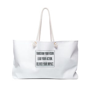 May include: White tote bag with rope handles. The bag features the text "TRANSFORM YOUR VISION. LEAD YOUR ACTION. DELIVER YOUR IMPACT." in a black rectangular box. The bag is designed for carrying items.