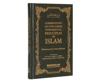 May include: A dark green hardcover book titled Commentary on the Three Fundamental Principles of Islam by Muhammad bin 'Abdul-Wahhab, featuring gold embossed text and an ornate decorative border on the front cover and spine.