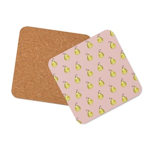 May include: Two square coasters. One is made of cork. The other has a pink background with a pattern of yellow pears. The pears have brown stems and are arranged in a grid pattern. The coasters are designed for use with beverages.