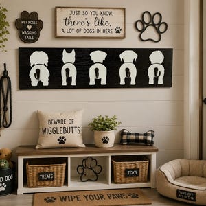May include: A dog-themed entryway with a bench, storage baskets, and decorative signs. The wall features a black sign with white dog rear ends, paw prints, and the text "Just so you know, there's like, a lot of dogs in here."