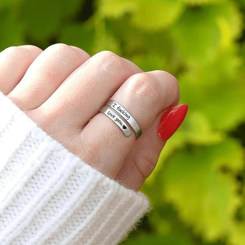 adjustable engraved ring worn on hand