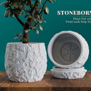 May include: A white, textured plant pot with a twist-lock drip tray, holding a small green plant. The pot has a rough, stone-like appearance. The text "STONEBORN" and "Plant Pot with Twist Lock Drip Tray" are visible.