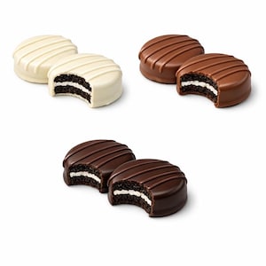 May include: Several chocolate-covered sandwich biscuits. Some are coated in white chocolate, others in milk chocolate. Each biscuit has a cream filling and a bite taken out of it, revealing the layers.