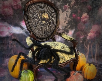 May include: A black spider with a yellow body sits on a black and yellow patterned chair with a spiderweb design. The chair is surrounded by a black spider with long legs and a fuzzy texture. The chair and spider are on a dark background with a floral pattern.