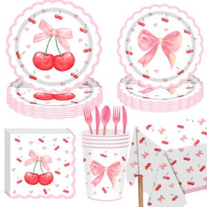 May include: A set of pink party supplies with a cherry theme. The set includes plates, napkins, cups, cutlery, and a tablecloth. The plates and napkins have a scalloped edge and a cherry and bow design. The cutlery is pink.