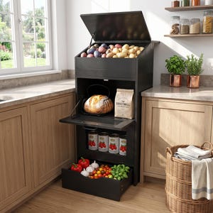 May include: A tall black wooden kitchen storage unit with three levels. The top bin holds potatoes, the middle shelf contains a loaf of bread in a wire basket and a bag labeled The Gristmill, and the bottom drawer holds fresh produce and canned goods.