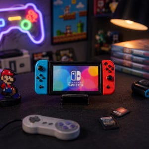 May include: A miniature Nintendo Switch console with blue and red controllers, displaying the Nintendo Switch logo on the screen. A retro-style controller and game cartridges are in the foreground. A neon gaming controller sign is in the background.