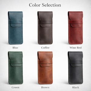 May include: A selection of leather pen cases in various colors, including blue, coffee, wine red, green, brown, and black. Each case features a flap closure and is displayed against a neutral background. The text "Color Selection" is at the top.