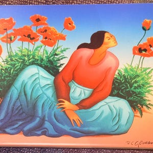 May include: A rectangular print featuring a person with dark hair wearing a coral-coloured long-sleeved top and a flowing blue skirt, sitting amidst vibrant orange poppy flowers against a gradient sky. The artist signature R.C. Gorman is visible.