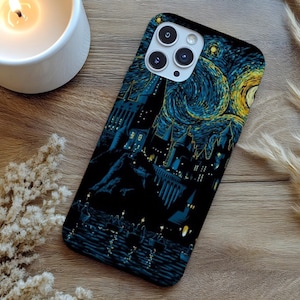 May include: Black phone case featuring a starry night design with a castle silhouette. The case has a glossy finish and a camera cutout. The design incorporates shades of blue and yellow, reminiscent of Van Gogh's style. The phone case is a protective accessory.