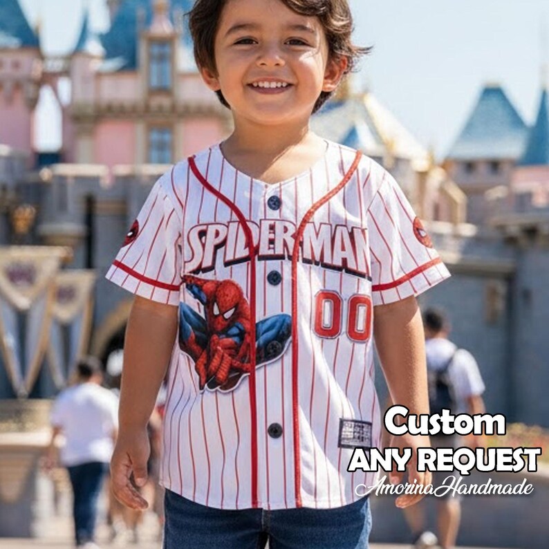 May include: A white and red pinstripe baseball jersey with "SPIDER-MAN" printed across the chest. The jersey features a Spider-Man graphic and the number "00". The text "Custom ANY REQUEST Amorina Handmade" is also visible.