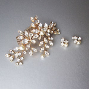 May include: Gold bridal hair comb with crystal and pearl embellishments, and matching earrings with crystal and pearl accents.