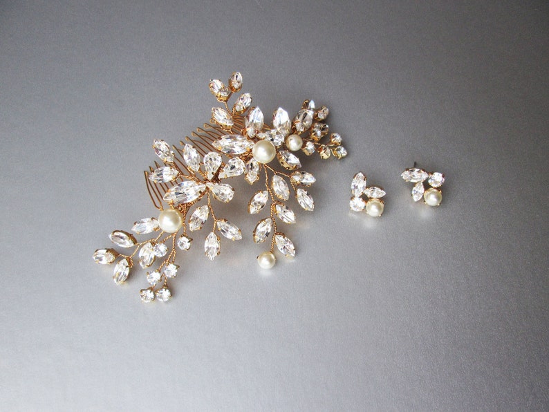 May include: Gold bridal hair comb with crystal and pearl embellishments, and matching earrings with crystal and pearl accents.
