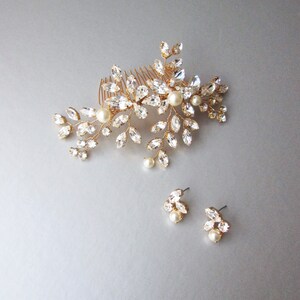 May include: Gold bridal hair comb with crystal and pearl embellishments. Matching earrings with crystal and pearl accents.
