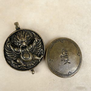 Brass Garuda Gau Box – Tibetan Buddhist Pendant with Om Symbol, Hand-Carved Protective Amulet