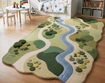 May include: A rectangular area rug featuring a textured landscape design with a winding blue river, light beige paths, and various shades of green patches representing grassy fields and clusters of raised, rounded tree-like shapes.