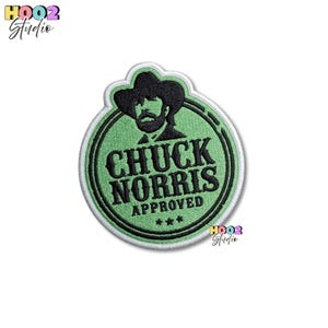 May include: Embroidered patch featuring a portrait of Chuck Norris in a cowboy hat, set within a green circle with a white border. The text "CHUCK NORRIS APPROVED" is displayed in black, with three stars below. The patch has a white background.