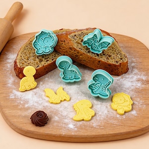 Presse à biscuits 3D dinosaure 4 pièces | Tampon ptérodactyle brontosaure | Emporte-pièce en pâte polymère à ressort | Moule à gâteries pour baby shower, garçon