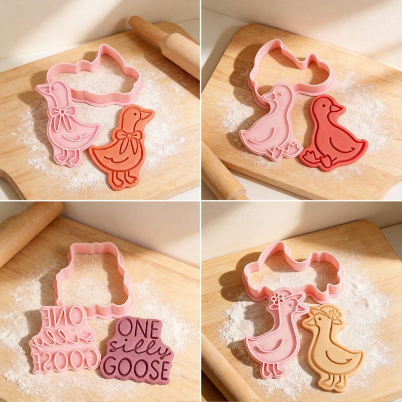 May include: A collection of pink and orange goose-shaped cookie cutters, including one with the text "ONE silly GOOSE". The cutters are on wooden cutting boards dusted with flour, with rolling pins in the background. Ideal for baking.