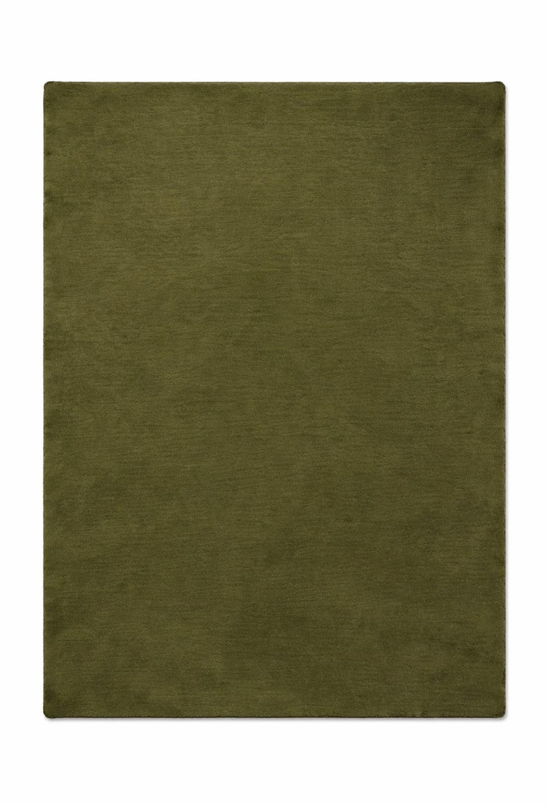 Handwoven olive green wool rug in solid color, modern minimalist floor rug for cozy home interiors