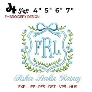 May include: An embroidery design featuring a light blue monogram within a shield shape, adorned with a bow and floral accents. The design includes the letters "FRL" and the name "Fisher Larkin Rainey". Available in sizes 4", 5", 6", and 7".