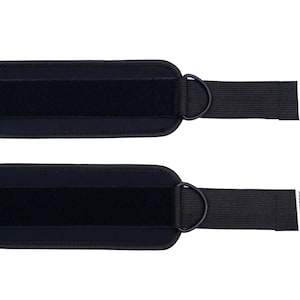 May include: Two black ankle straps with D-rings and Velcro closures. Each strap has a rectangular label with the text "PULSEWEAR" and a graphic of a heartbeat. The straps are designed for fitness and exercise.