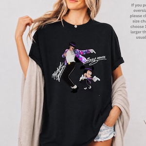 Unisex t-shirt, sweatshirt, hoodie, and baby bodysuit featuring a Michael Jackson and Mickey Mouse dancing graphic with galaxy jacket details and pop icon theme.