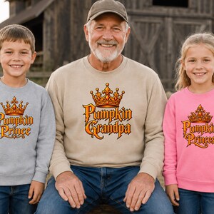 Adult t-shirt, toddler t-shirt, youth t-shirt, and adult or youth sweatshirt with personalized pumpkin family title graphic such as Queen, King, Princess, or Prince