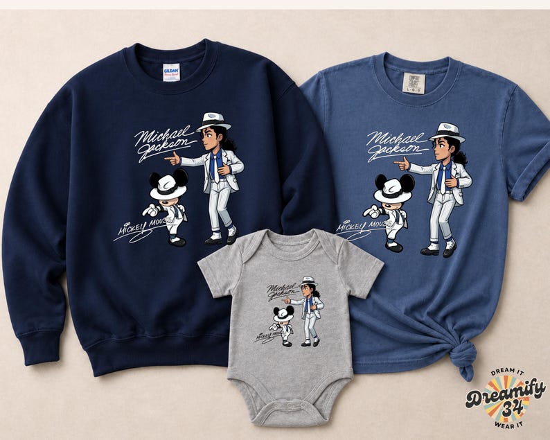 May include: Navy blue sweatshirt, blue t-shirt, and gray baby onesie featuring a cartoon illustration of Michael Jackson and Mickey Mouse. The graphic includes the text "Michael Jackson" and "Mickey Mouse".