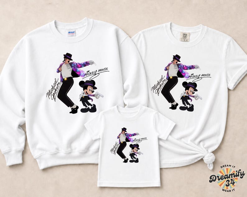 Unisex t-shirt, sweatshirt, hoodie, and baby bodysuit featuring a Michael Jackson and Mickey Mouse dancing graphic with galaxy jacket details and pop icon theme.