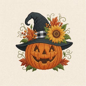 May include: An embroidered design featuring a smiling jack-o'-lantern wearing a black witch hat with a white and black buffalo check band. The hat is decorated with a large yellow sunflower, orange autumn leaves, green foliage, and berries.
