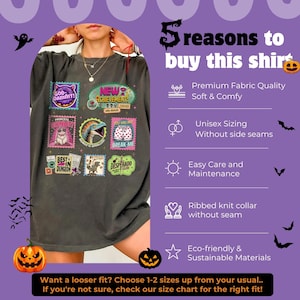 May include: Dark gray t-shirt with multiple colorful stamp-like graphics. The stamps feature various designs and text, including "GOD-DAMNIT!", "NEW ACHIEVEMENT!", and "BREAK ME". The shirt also has text that says "5 reasons to buy this shirt".