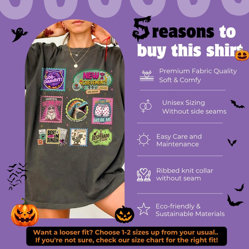 May include: Dark gray t-shirt with multiple colorful stamp-like graphics. The stamps feature various designs and text, including "GOD-DAMNIT!", "NEW ACHIEVEMENT!", and "BREAK ME". The shirt also has text that says "5 reasons to buy this shirt".
