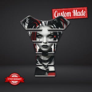 May include: A motorcycle tank protector decal featuring a black and white illustration of a person with red hair accents, wearing a studded collar. The graphic includes the text Custom Made and a 5 Year Warranty badge in the corner of the image.