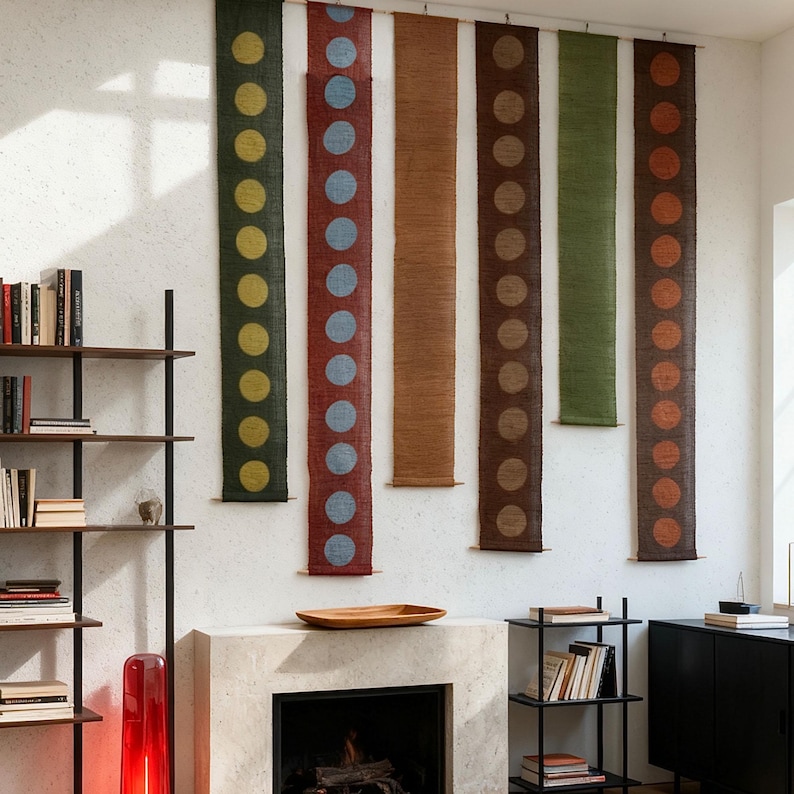 May include: Six vertical wall hangings with a repeating dot design. The hangings are in shades of green, red, brown, and orange. Each is approximately 152 cm long and 15 cm wide. The dots are in contrasting colours, creating a striking visual.