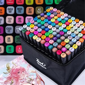 May include: A set of 120 dual-tip markers arranged in a black carrying case with a colour-coded chart. Each marker cap displays a specific colour name and number. The case features the text Touch 120pcs printed in white on the front side.