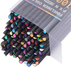 May include: A clear plastic box containing 100 fineliner pens. The pens have black barrels and a variety of coloured tips, including blue, green, pink, and orange. The text "FINELINER PEN 0.4mm" is printed on the box.