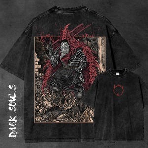 May include: Black graphic t-shirts featuring designs from the video game Dark Souls. One shirt displays a detailed illustration of a knight with a red cloak, while the other has a red symbol.