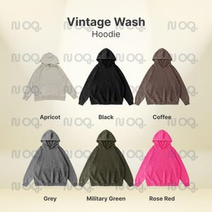 K&ouml;nnte beinhalten: Pr&auml;sentation von sechs Vintage-Wash-Hoodies in verschiedenen Farben: Aprikot, Schwarz, Kaffee, Grau, Milit&auml;rgr&uuml;n und Rosenrot. Jeder Hoodie hat eine Kapuze und eine Vordertasche. Der Text "Vintage Wash Hoodie" ist sichtbar.