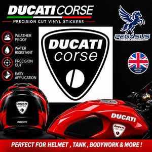 May include: A black and white Ducati Corse shield decal featuring the text DUCATI CORSE. The graphic is displayed alongside a red motorcycle helmet and a red motorcycle fuel tank, both featuring the same shield logo sticker applied to them.
