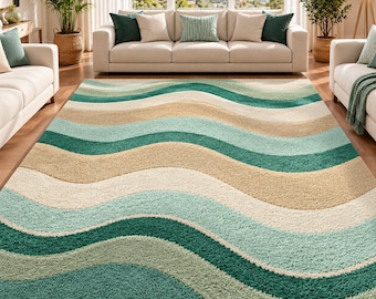 May include: A rectangular area rug featuring a wavy, multi-colored pattern of deep teal, light mint green, cream, and beige. The rug has a thick, textured pile surface with repeating horizontal undulating lines that span the entire width.