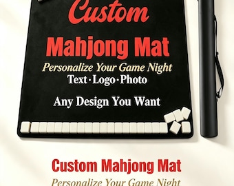 May include: A black rectangular mahjong mat featuring the red and white text Custom Mahjong Mat, Personalize Your Game Night, Text, Logo, Photo, Any Design You Want. White mahjong tiles are arranged on the mat and a black carrying case is included.