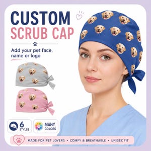 May include: A blue scrub cap featuring a repeating pattern of golden retriever faces. The image also shows gray and pink scrub caps with the same pattern. Text on the image reads "CUSTOM SCRUB CAP" and "Add your pet face, name or logo."