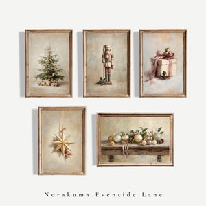 May include: A set of five framed wall art prints featuring Christmas themes: a decorated tree, a nutcracker, a gift box with a pink ribbon, a hanging star ornament, and a collection of gold and silver baubles on a wooden table. Norakuma Eventide Lane.