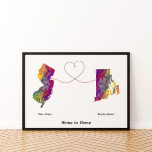 May include: A framed print featuring the states of New Jersey and Rhode Island in a multicoloured marbled pattern. A thin line connects the two states, forming a heart shape in the centre. The text "New Jersey", "Rhode Island", and "Home to Home" appear.