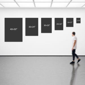 May include: Six rectangular black wall art canvases arranged in a row, labeled with dimensions 40x30", 36x24", 30x20", 24x16", 16x12", and 12x8" in white text. The canvases are displayed on a plain white wall in a gallery-style setting.