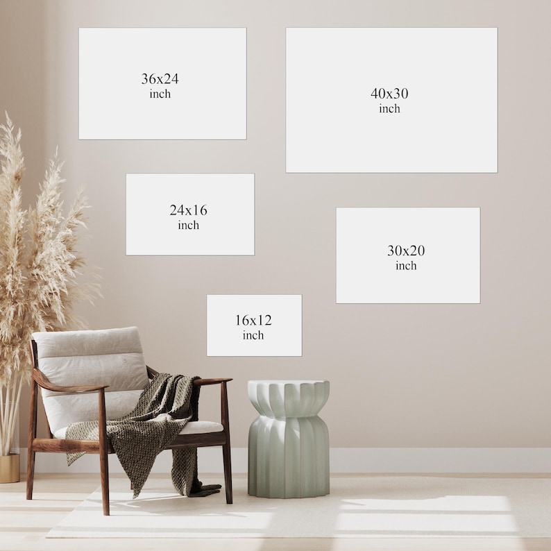 May include: Five rectangular white wall art placeholders with dimensions printed in black text: 36x24 inch, 40x30 inch, 24x16 inch, 30x20 inch, and 16x12 inch. A wooden armchair with a draped throw blanket and a fluted side table are positioned below.