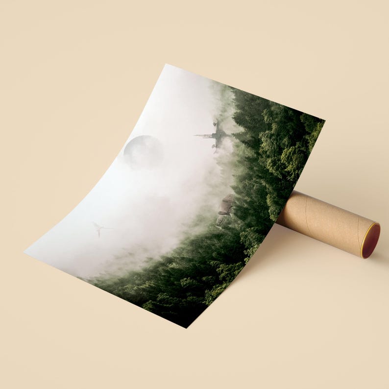 May include: A rectangular art print rolled into a cardboard tube, featuring a landscape illustration of a dense green forest under a pale, foggy sky with a large moon, a distant castle silhouette, and a small flying bird in the atmosphere.