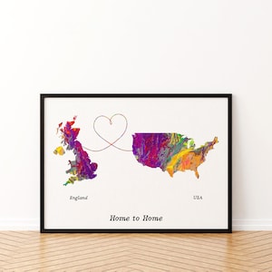 May include: A framed wall art print featuring a colorful, abstract paint-swirl map of England and the USA connected by a thin line forming a heart shape. The text "England", "USA", and "Home to Home" is printed in black below the maps.