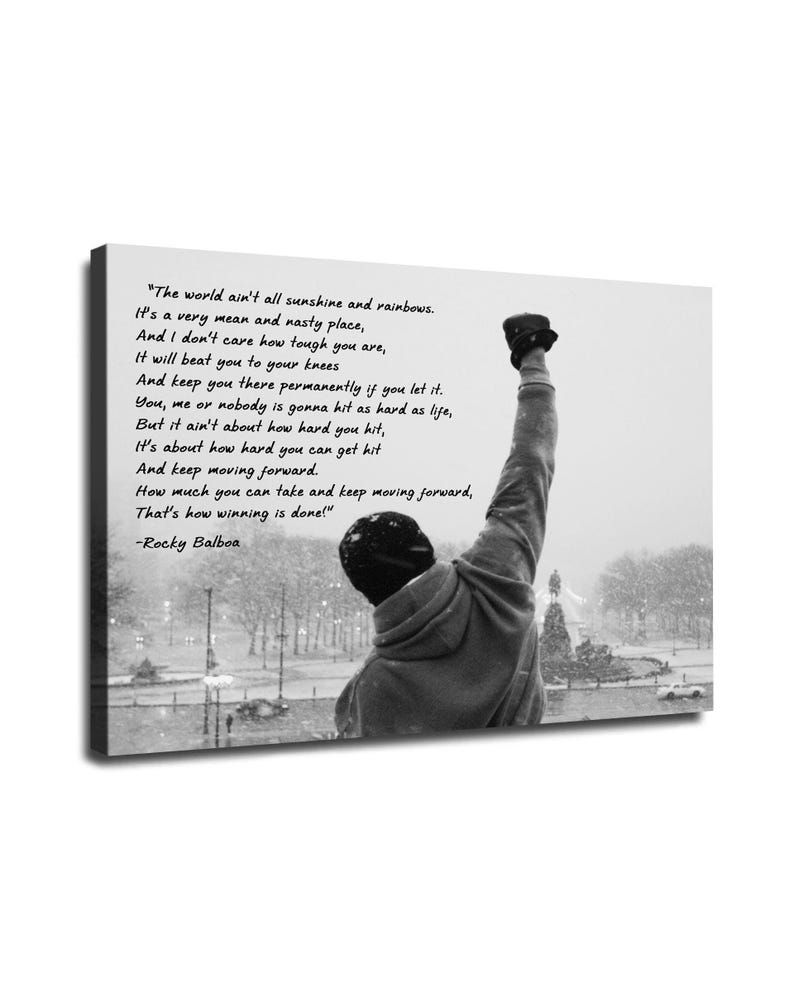 May include: Black and white canvas print featuring a silhouette of a person with their fist raised in the air. The print includes a quote from Rocky Balboa about overcoming challenges and the harsh realities of life.